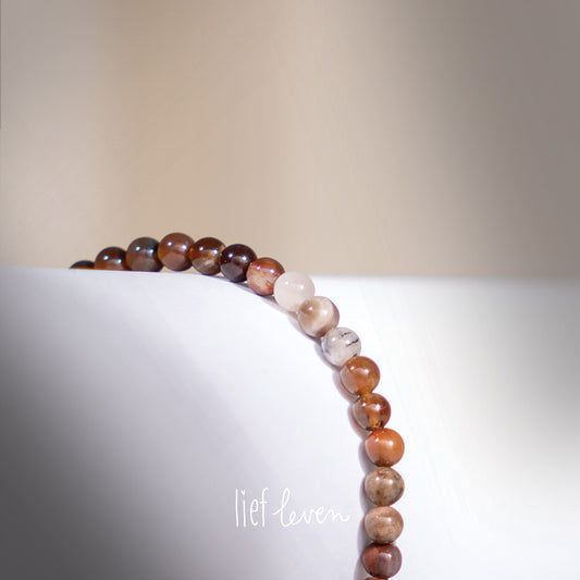 Kralenarmband • Versteend hout
